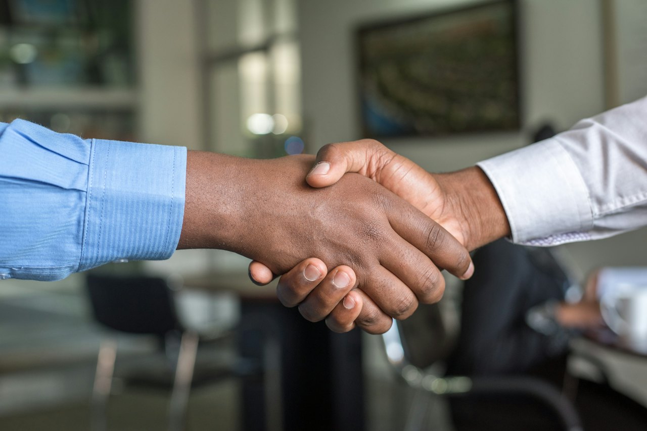 Business handshake between buyer and supplier
